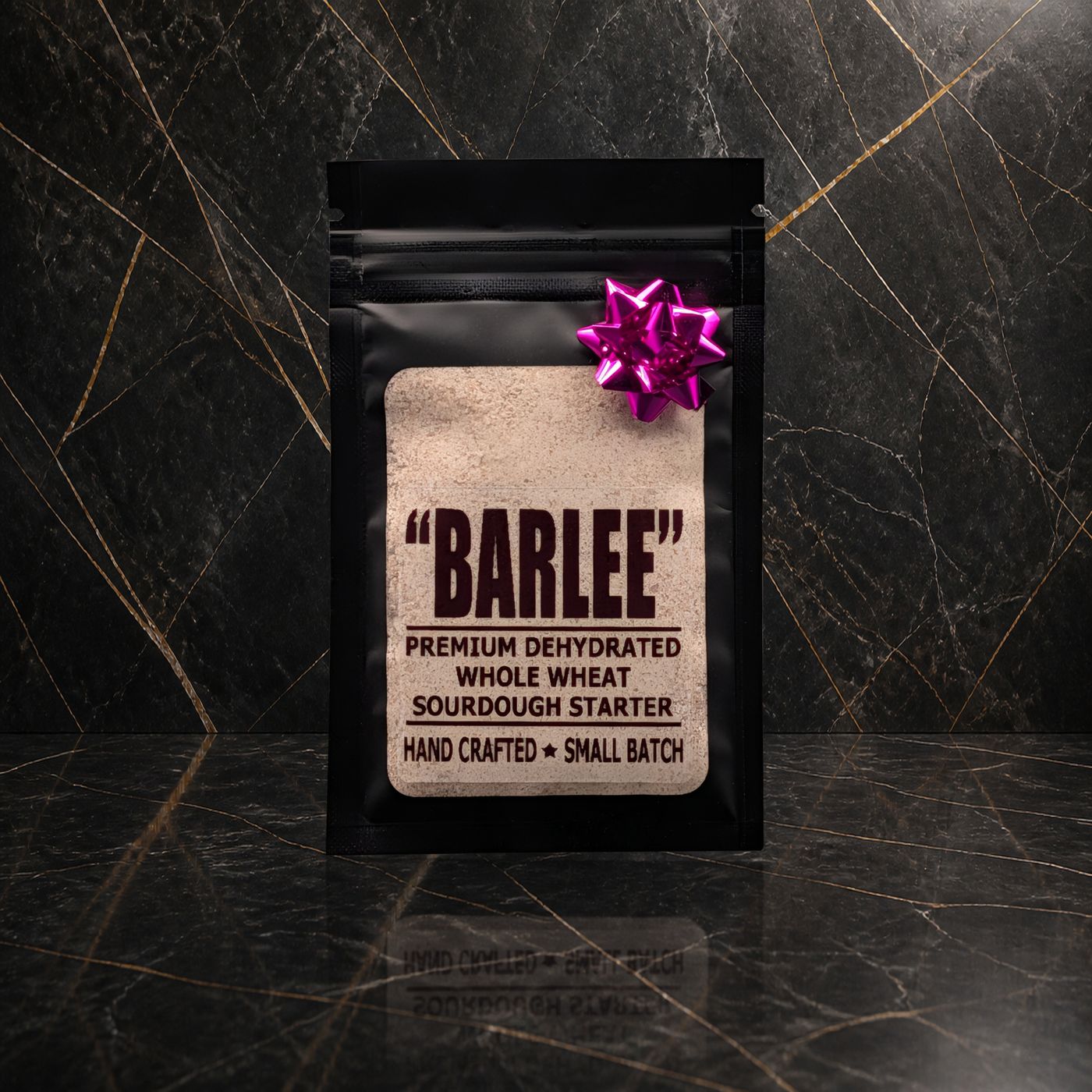 Barlee whole wheat sourdough starter pouch with a magenta bow on black marble